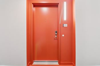 A red door with a number 310 on it.